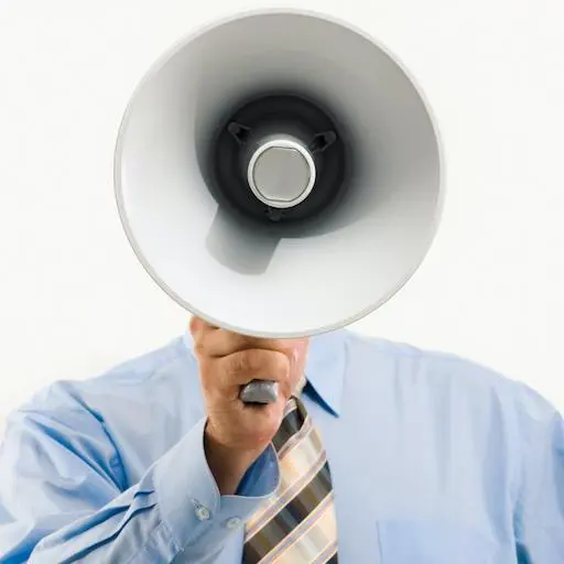 man shouting through a megaphone